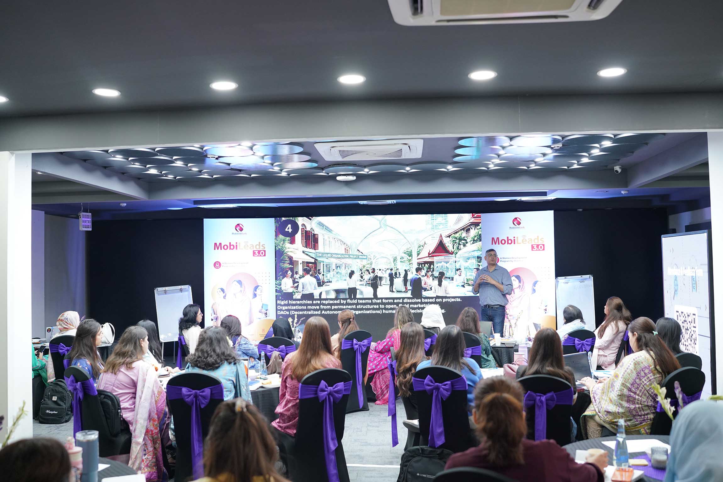 Wide view of MMBL AI adoption workshop room with 42 senior women leaders in one intensive day of training.