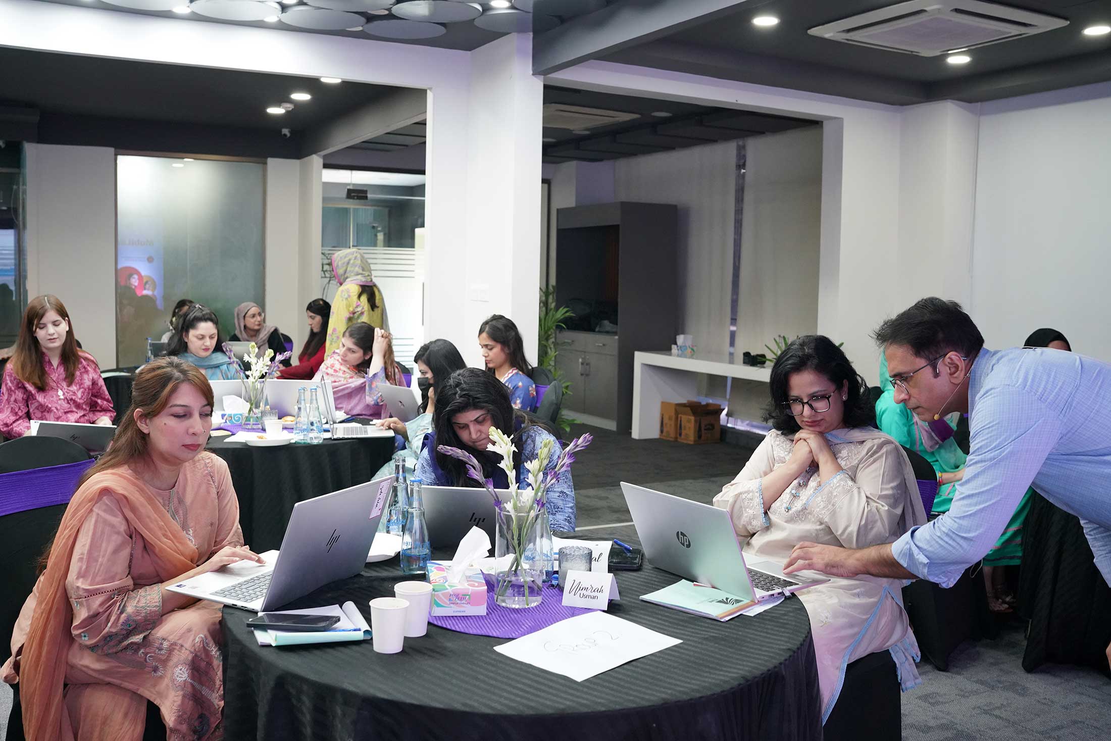 MMBL senior leaders shipping AI deliverables live on their own laptops during Think FRST workshop.